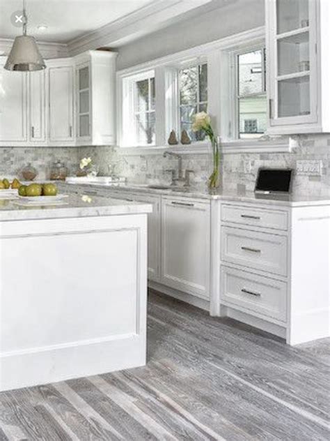 white kitchen cabinets grey floor